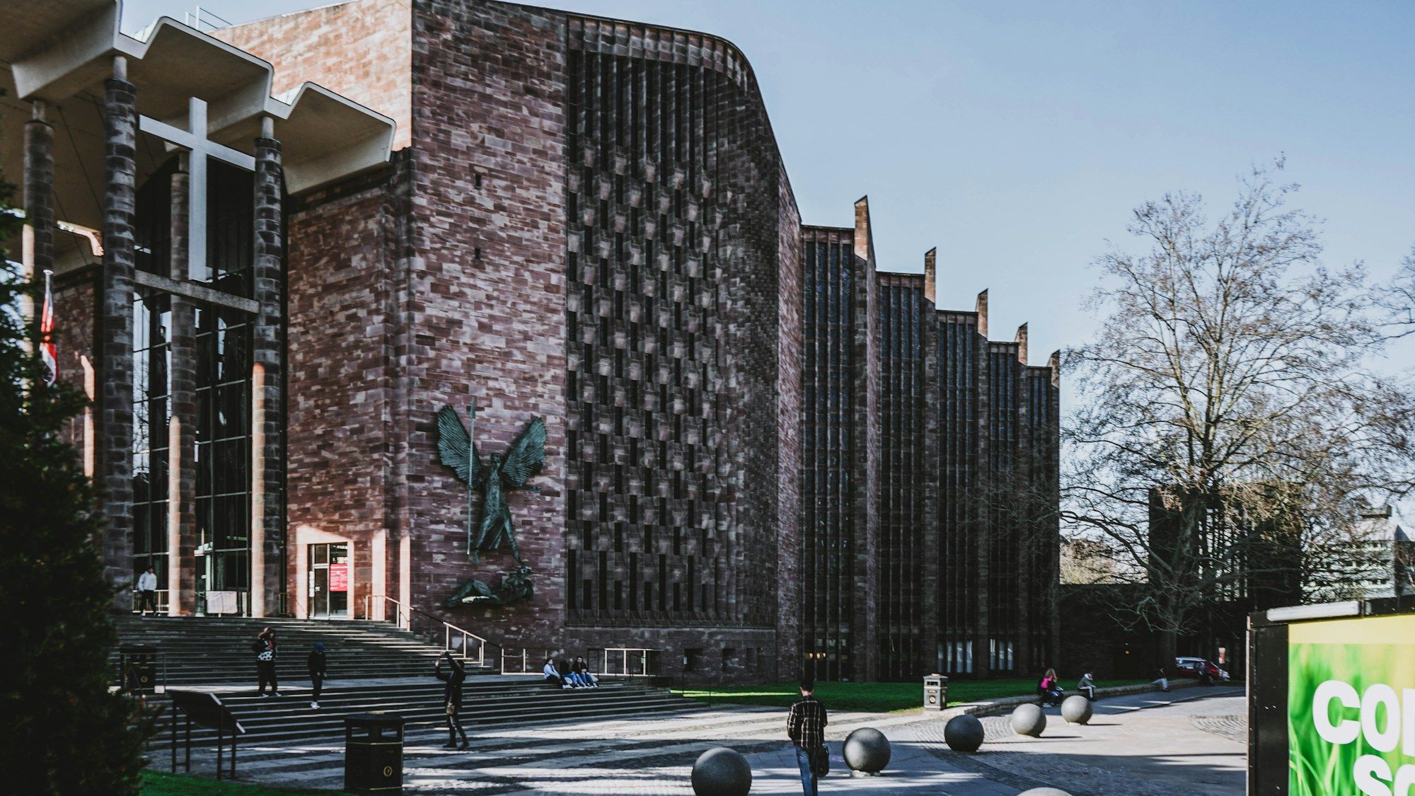 Coventry Cathedral with a bronze sculpture on its wall